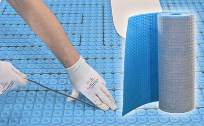 Prodeso underlayment membrane with ComfortTile floor heating cable being installed.