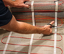 Cut the mesh backing to make a turn with the floor heating mat.